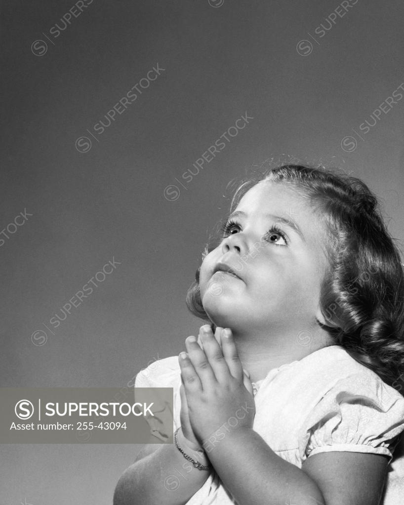 Stock Photo: 255-43094 Close-up of a girl praying
