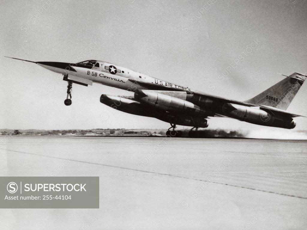 Stock Photo: 255-44104 Side profile of a bomber plane taking off, B-58 Hustler
