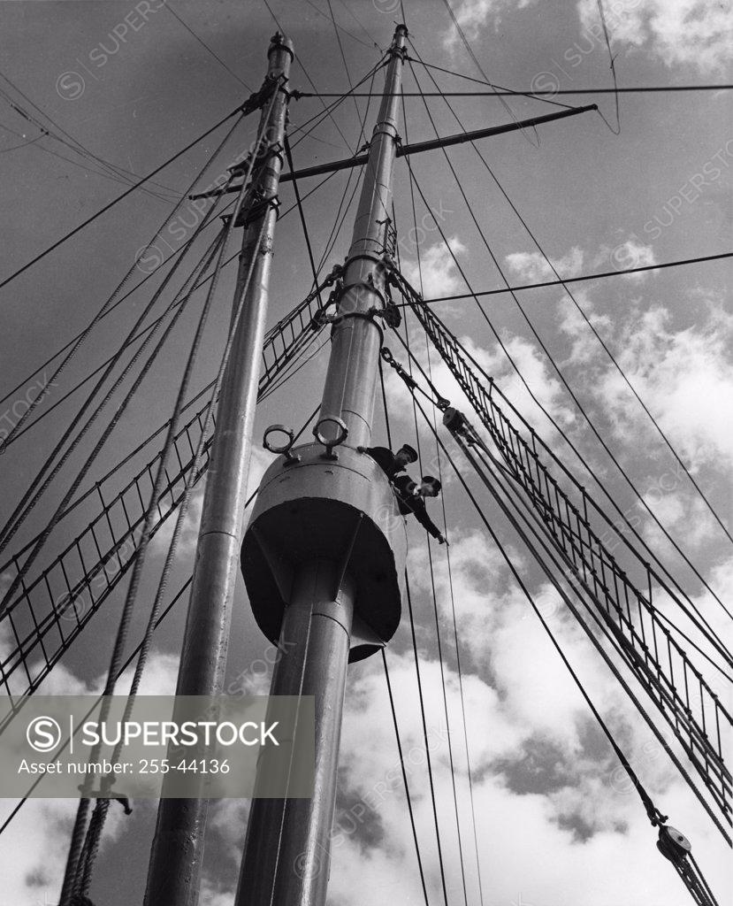 Stock Photo: 255-44136 Low angle view of two masts of a military ship
