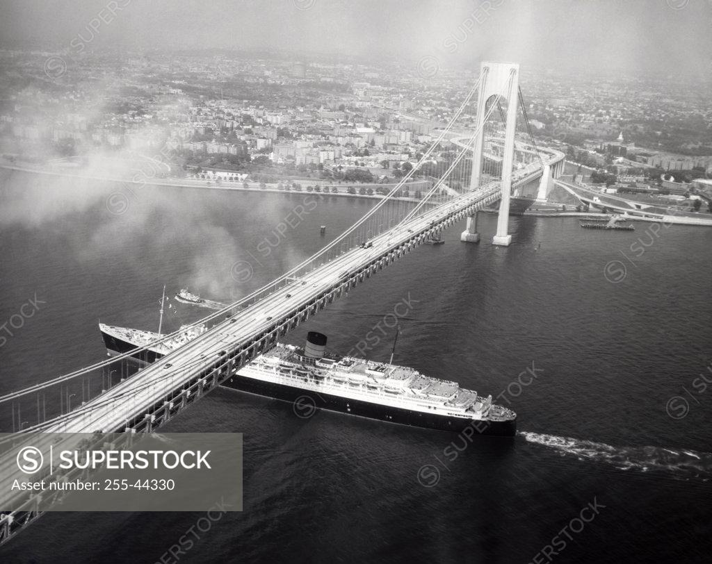 Stock Photo: 255-44330 USA, New York State, New York City, High angle view of cruise ship passing under Verrazano-Narrows Bridge