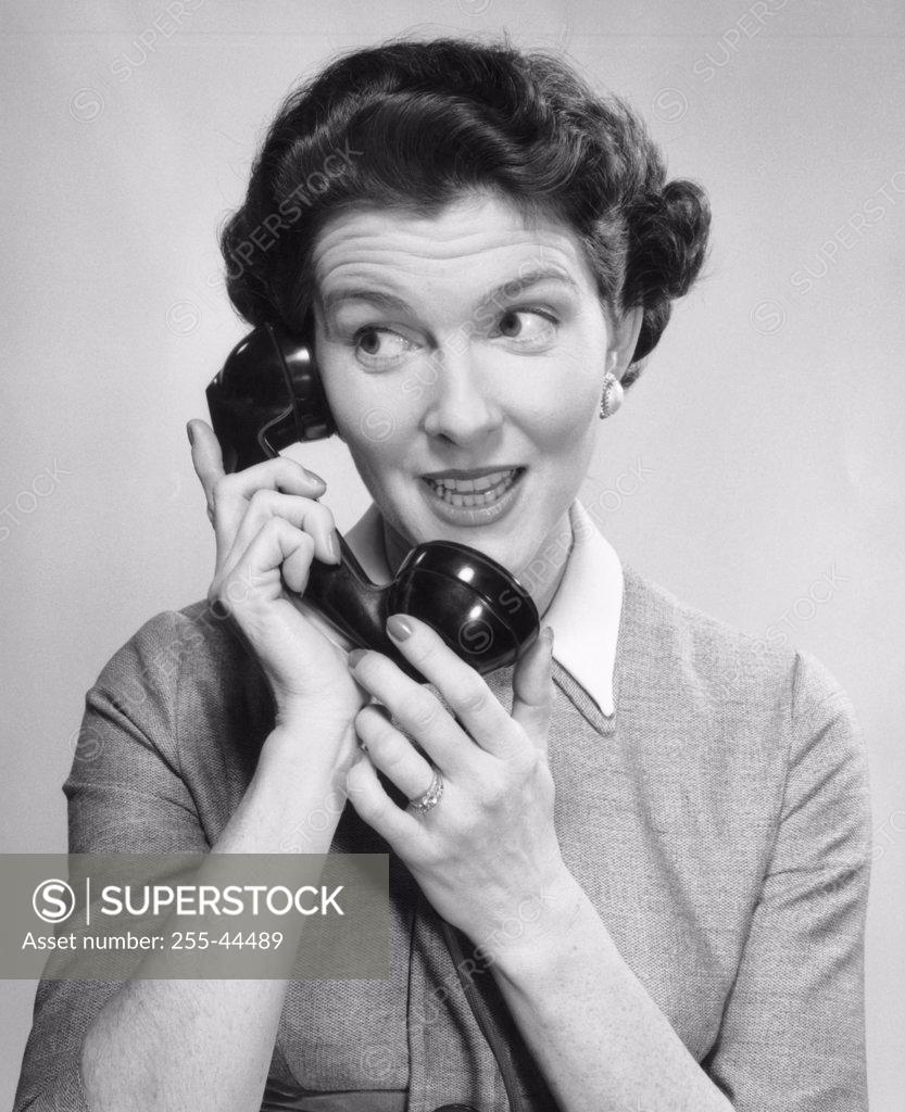 Stock Photo: 255-44489 Close-up of a young woman talking on the telephone
