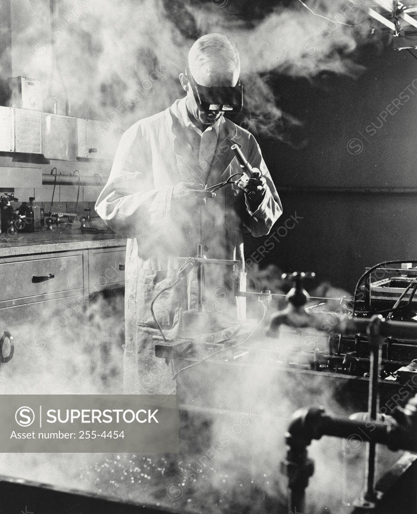 Stock Photo: 255-4454 Technician plating a measuring device, Measurements Laboratory, General Electric, Lynn, Massachusetts, USA
