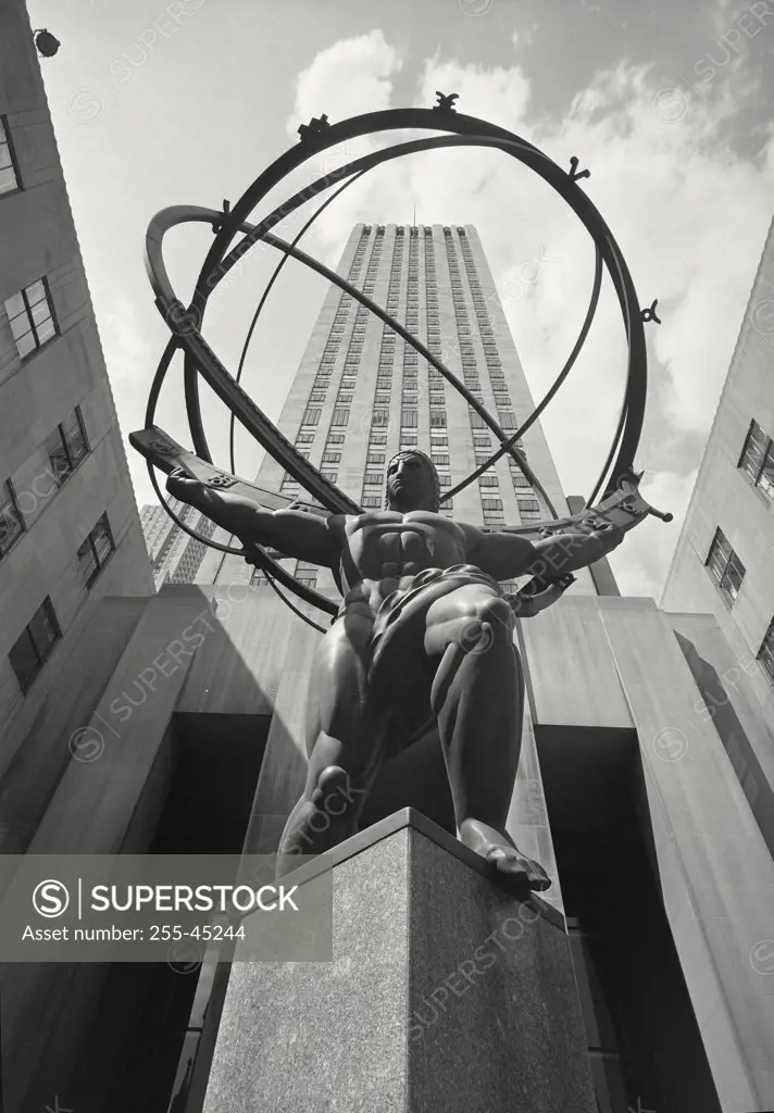 Vintage photograph. Low angle view of Atlas Statue in front of the International Building in Rockefeller Center, Manhattan, New York City, New York, USA