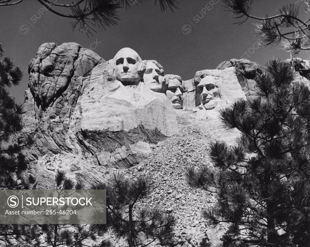 Stock Photo: 255-46204 USA, South Dakota, Mount Rushmore National Memorial, low angle view of sculptures of US Presidents carved in mountain