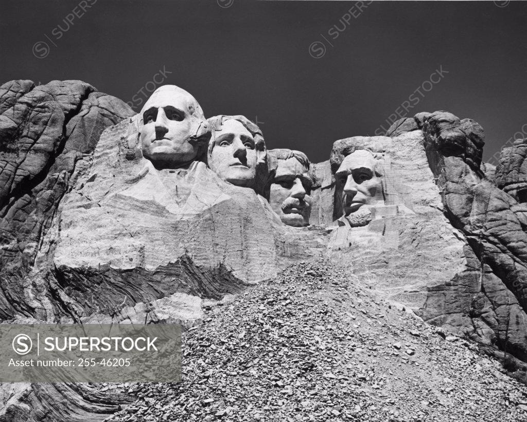 Stock Photo: 255-46205 USA, South Dakota, Mount Rushmore National Memorial, low angle view of sculptures of US Presidents carved in mountain