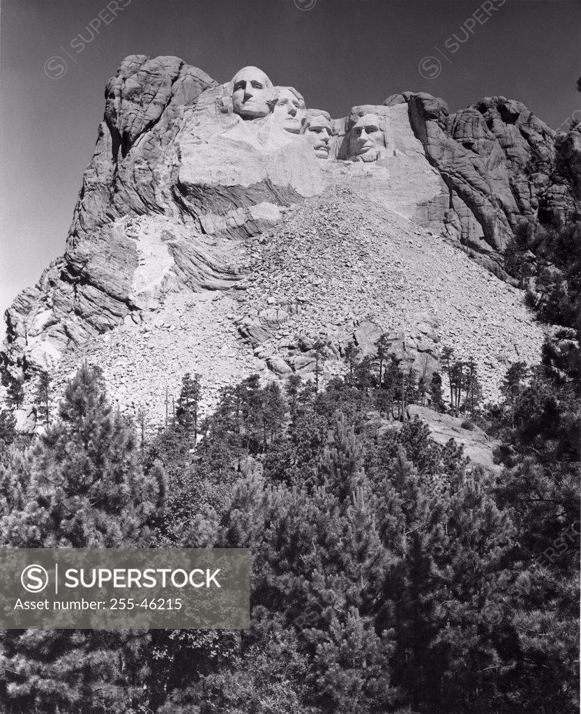 Stock Photo: 255-46215 USA, South Dakota, Mount Rushmore National Memorial, low angle view of sculptures of US Presidents carved in mountain