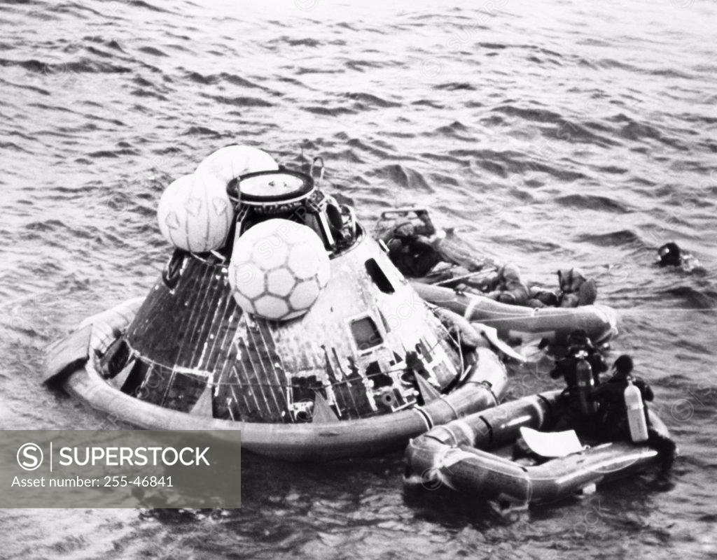 Stock Photo: 255-46841 High angle view of a rescue squad near a space capsule in the sea