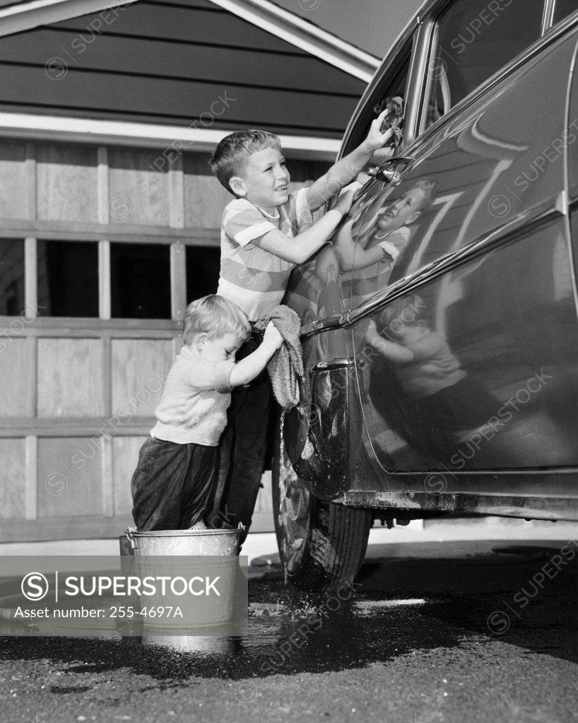 Stock Photo: 255-4697A Two boys cleaning a car