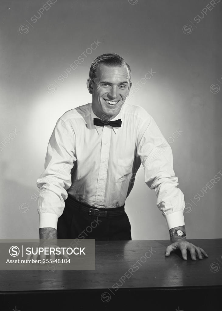 Stock Photo: 255-48104 Studio portrait of businessman smiling