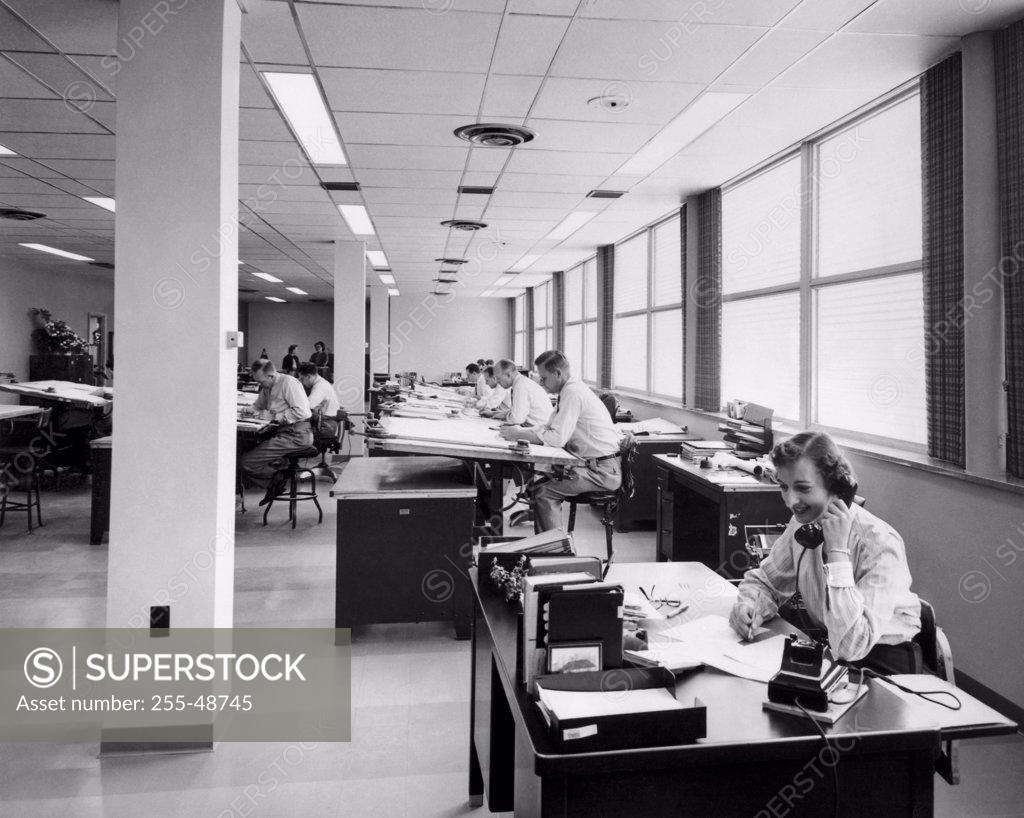 Stock Photo: 255-48745 High angle view of office workers in a drafting room