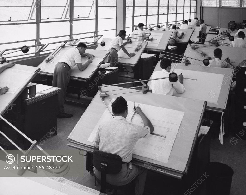 Stock Photo: 255-48773 Rear view of engineers working in a drafting room, Consolidated Engineering Company, Rochester, New York State, USA