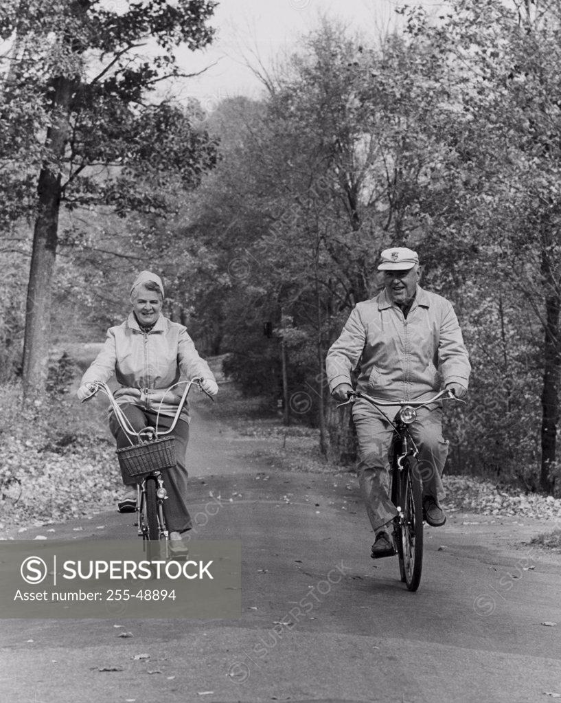 Stock Photo: 255-48894 Senior couple riding bicycles