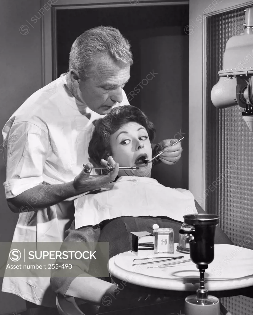 Young woman getting a treatment from a dentist