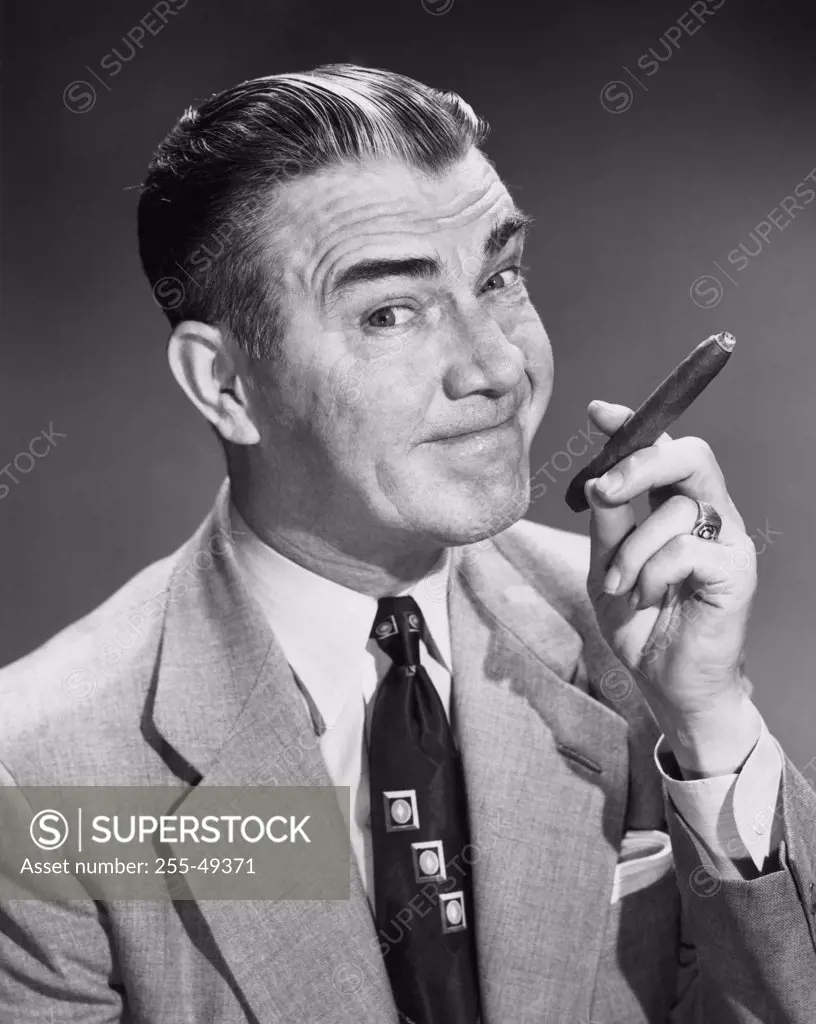 Portrait of mature man smoking cigar