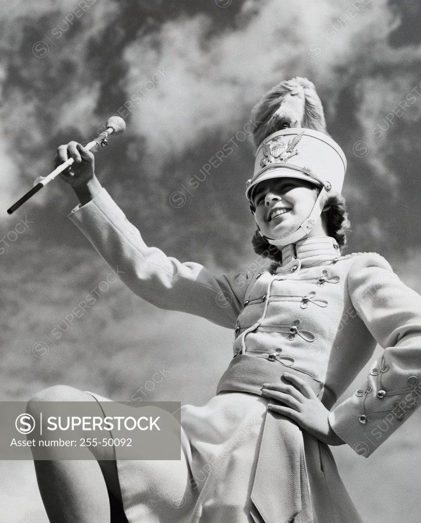 Stock Photo: 255-50092 Low angle view of majorette twirling baton