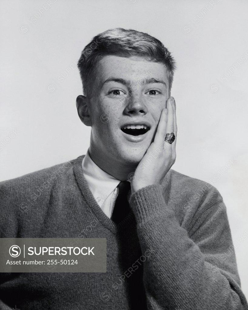 Stock Photo: 255-50124 Portrait of a teenage boy looking surprised