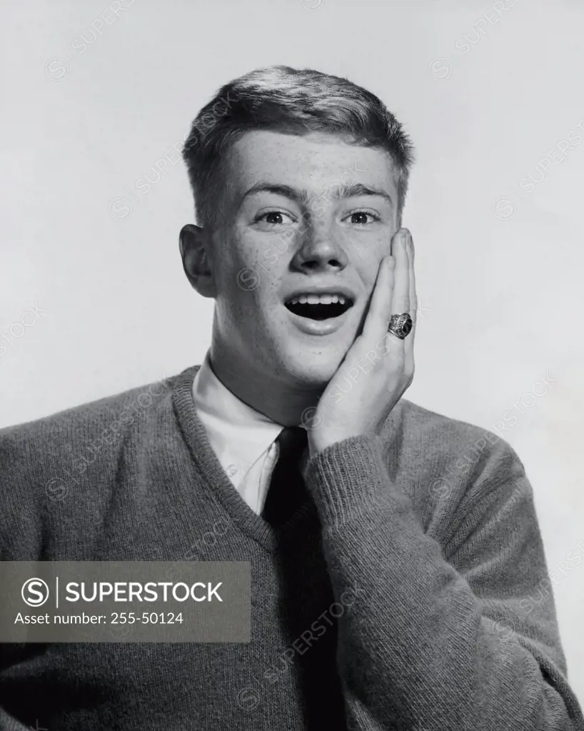 Portrait of a teenage boy looking surprised