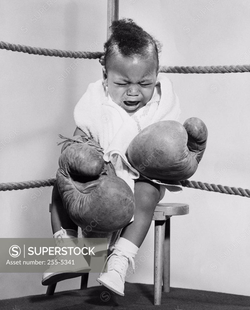 Stock Photo: 255-5341 Crying baby dressed like boxer