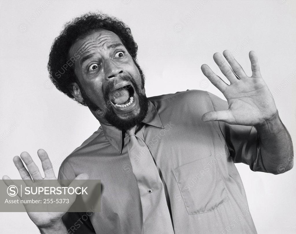 Stock Photo: 255-5373 Close-up of a mid adult man looking frightened