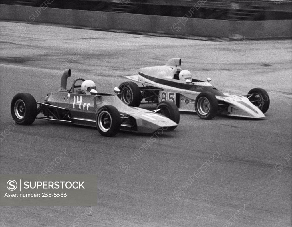 Stock Photo: 255-5566 Two Formula One race cars on a racing track