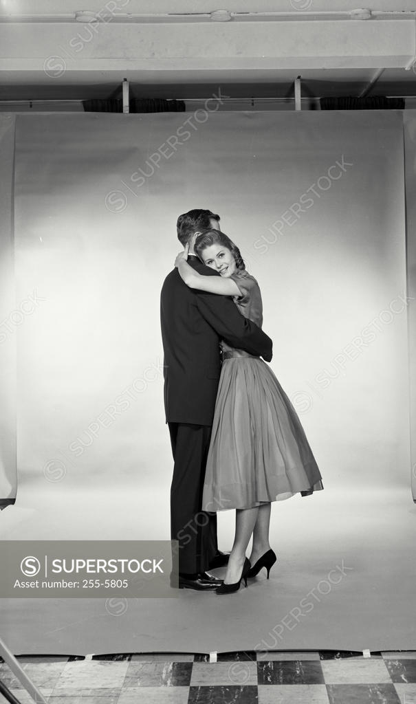 Stock Photo: 255-5805 Side profile of a young couple embracing