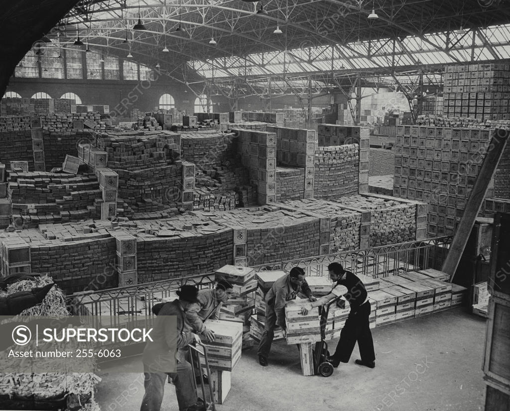 Stock Photo: 255-6063 High angle view of four workers in a warehouse