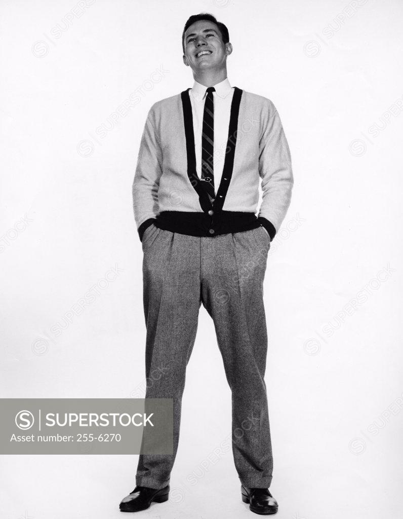 Stock Photo: 255-6270 Young man standing with hands in pockets