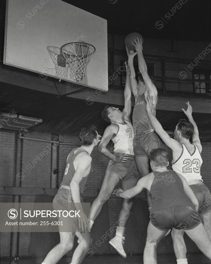 Stock Photo: 255-6301 Group of basketball players playing basketball