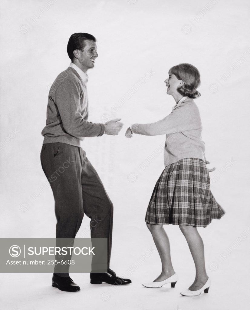 Stock Photo: 255-6608 Side profile of a young couple dancing