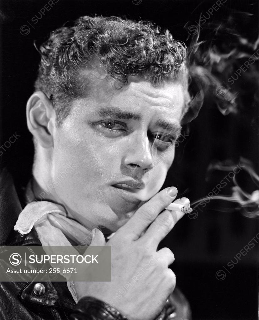 Stock Photo: 255-6671 Young man smoking