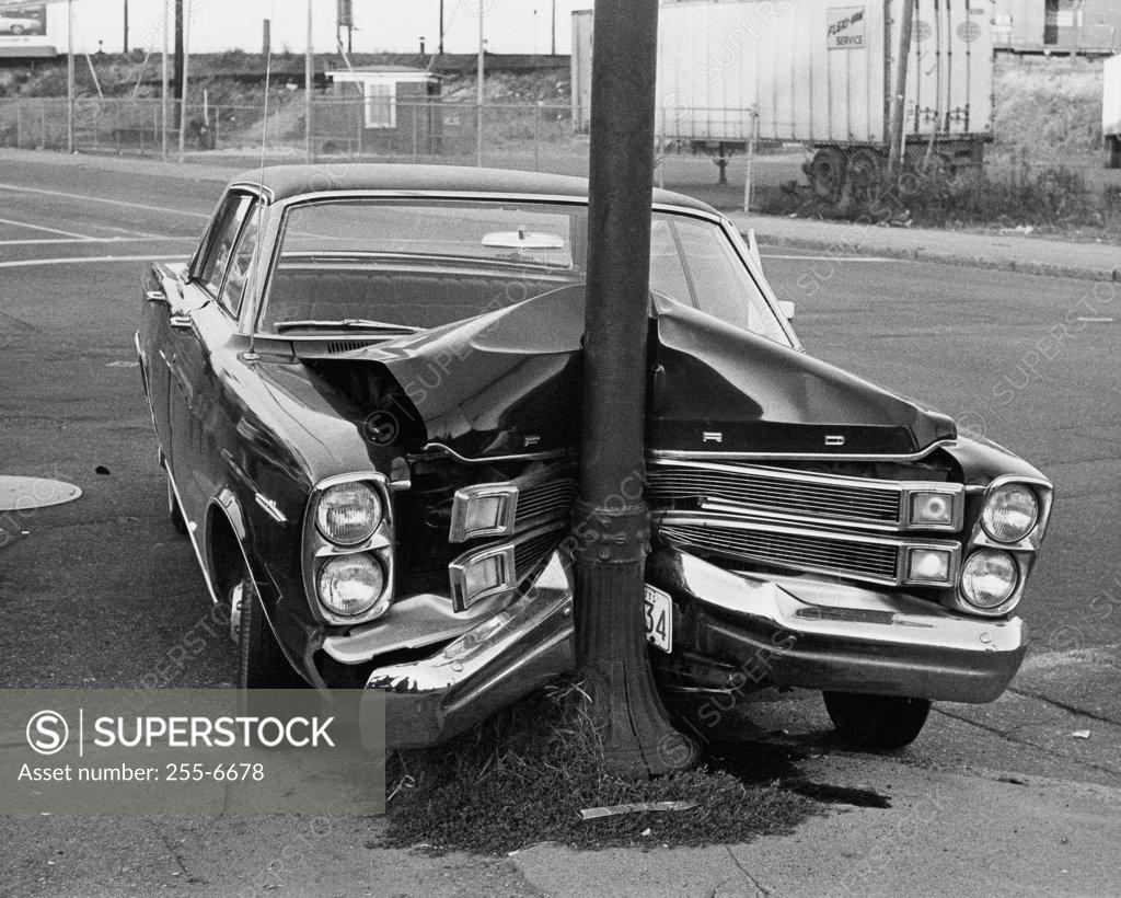Stock Photo: 255-6678 Damaged car after hitting a pole