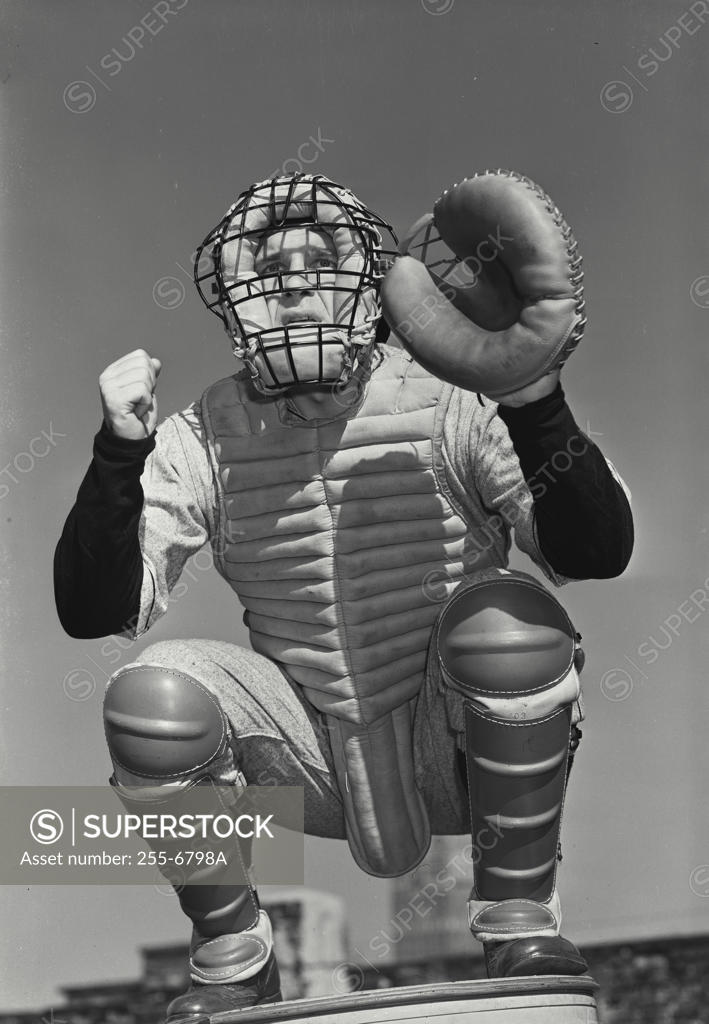 Stock Photo: 255-6798A Low angle view of a baseball catcher crouching