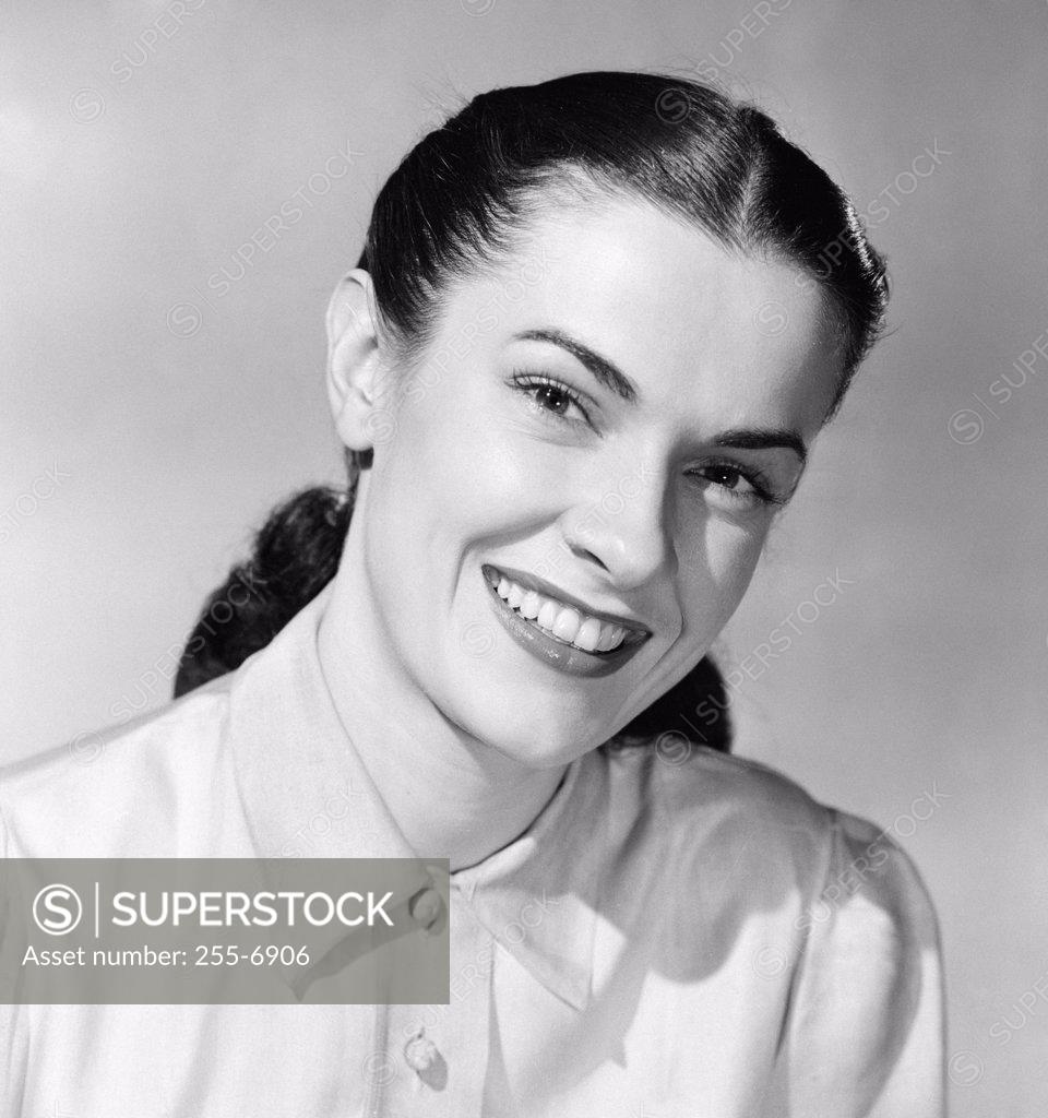 Stock Photo: 255-6906 Portrait of a young woman smiling