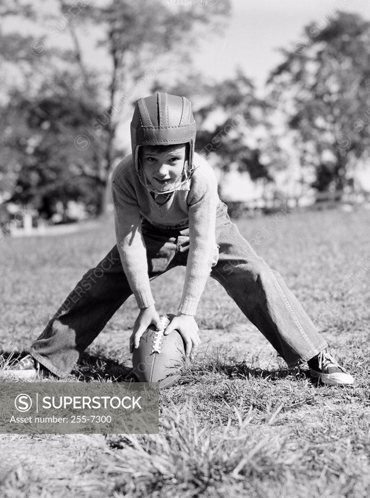 Stock Photo: 255-7300 Portrait of a boy playing football