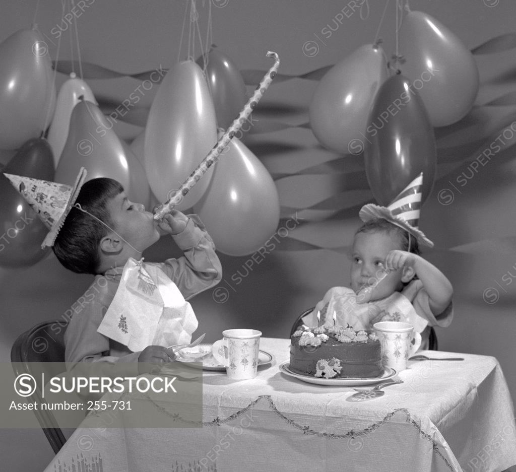 Stock Photo: 255-731 Boy and girl at birthday party