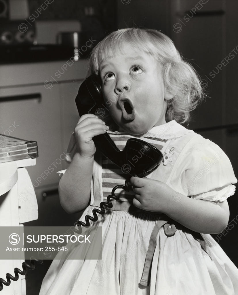 Stock Photo: 255-848 Close-up of a girl talking on the telephone