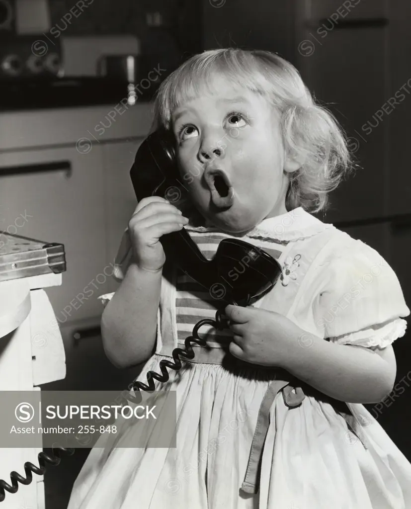 Close-up of a girl talking on the telephone