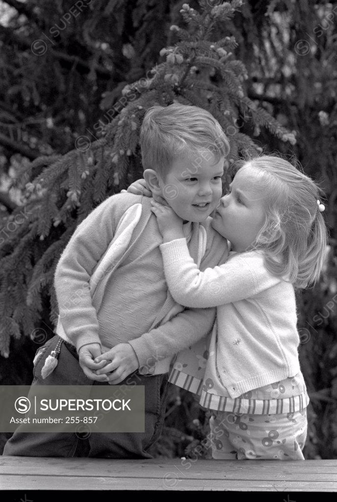 Stock Photo: 255-857 Little girl kissing boy