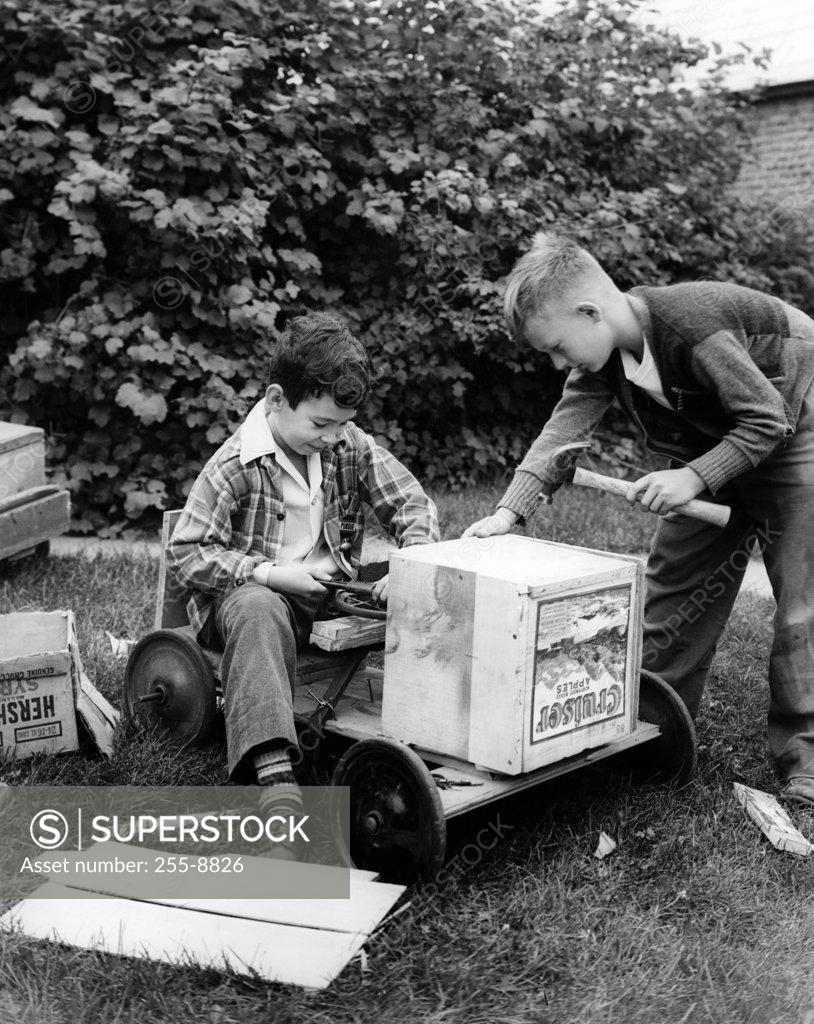 Stock Photo: 255-8826 Boys constructing toy car