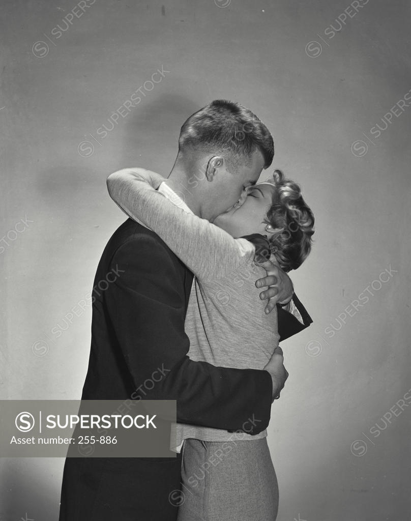 Stock Photo: 255-886 Side profile of a young couple kissing