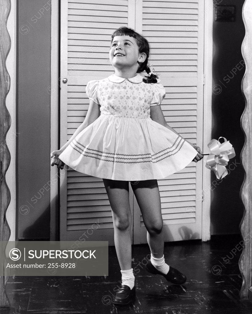 Stock Photo: 255-8928 Girl wearing dress in home