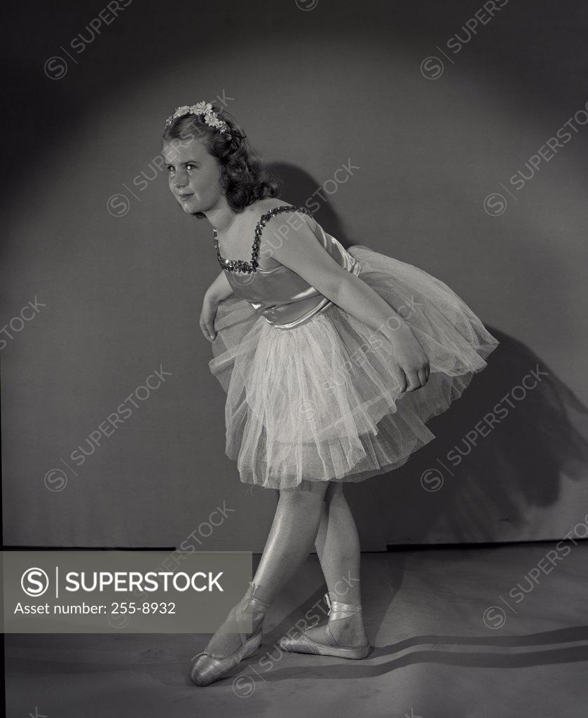 Stock Photo: 255-8932 Ballet dancer girl bowing at stage