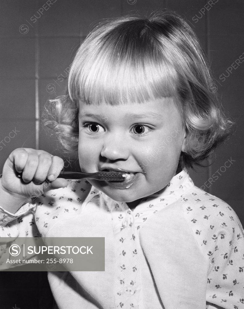 Stock Photo: 255-8978 Girl brushing teeth