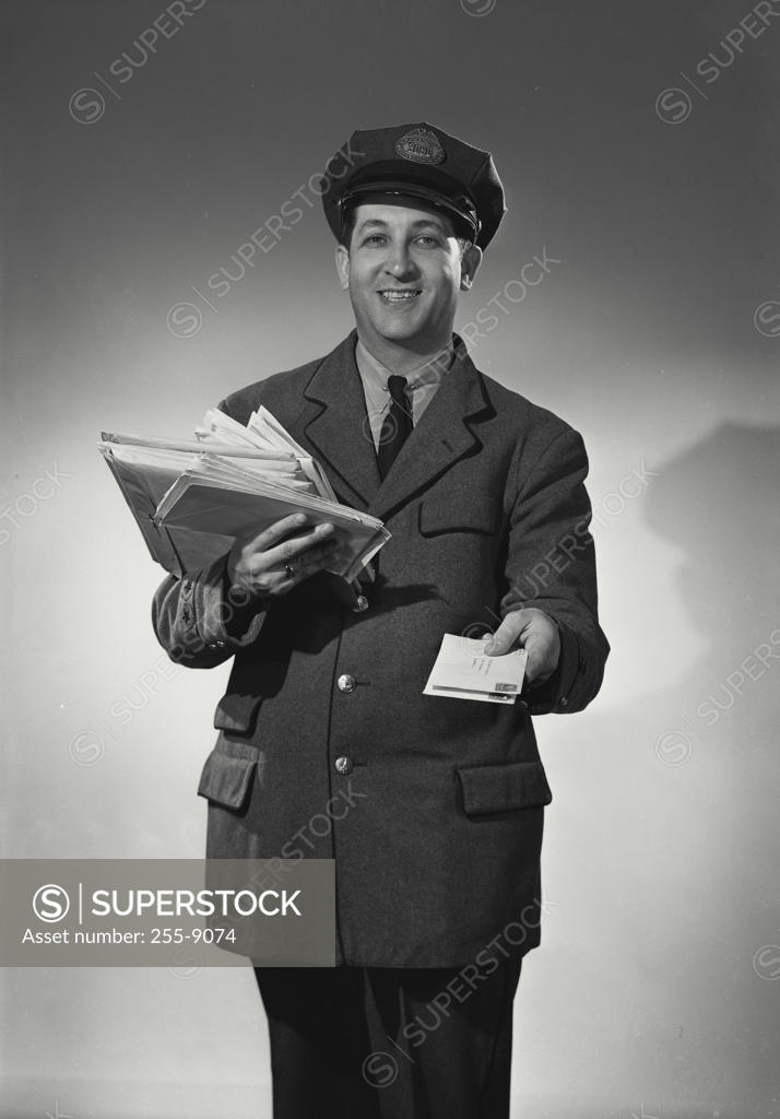 Stock Photo: 255-9074 Portrait of a postman delivering mail