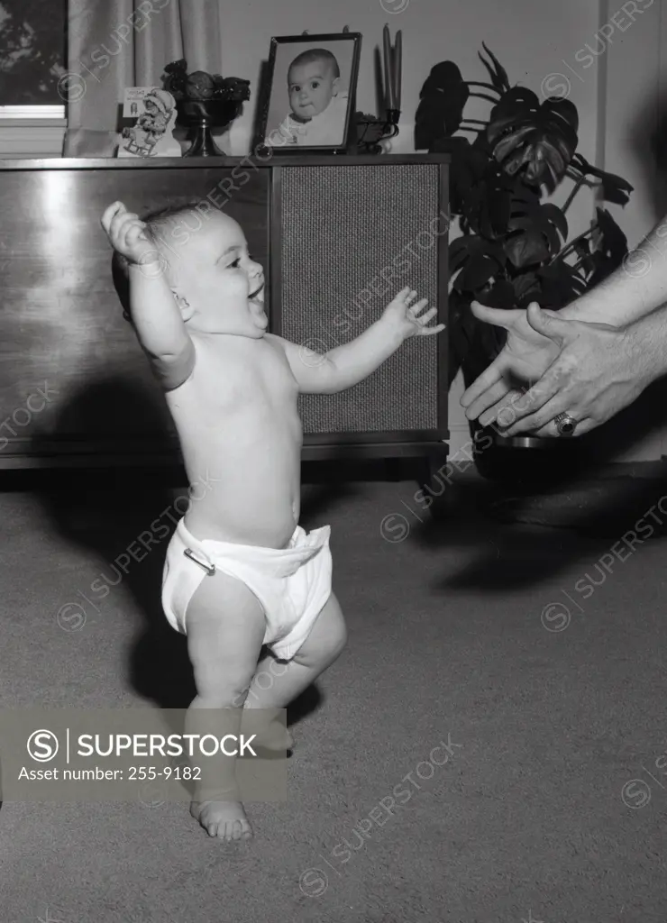 Portrait of baby doing first step