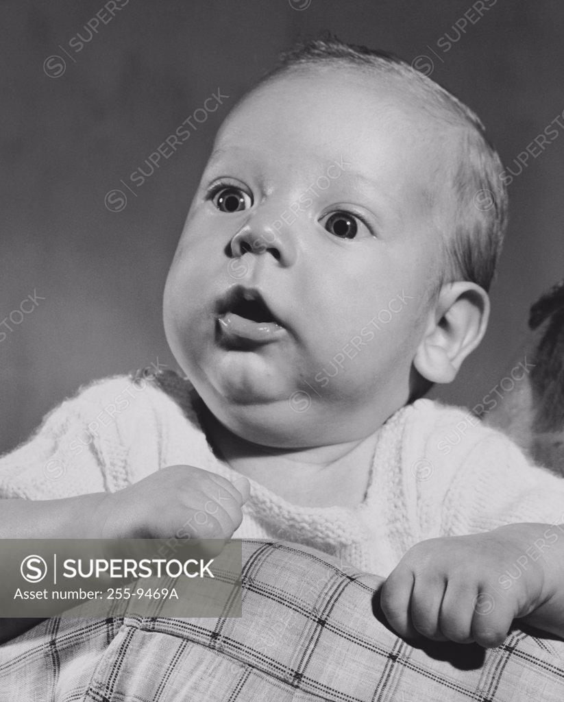 Stock Photo: 255-9469A Baby holding blanket