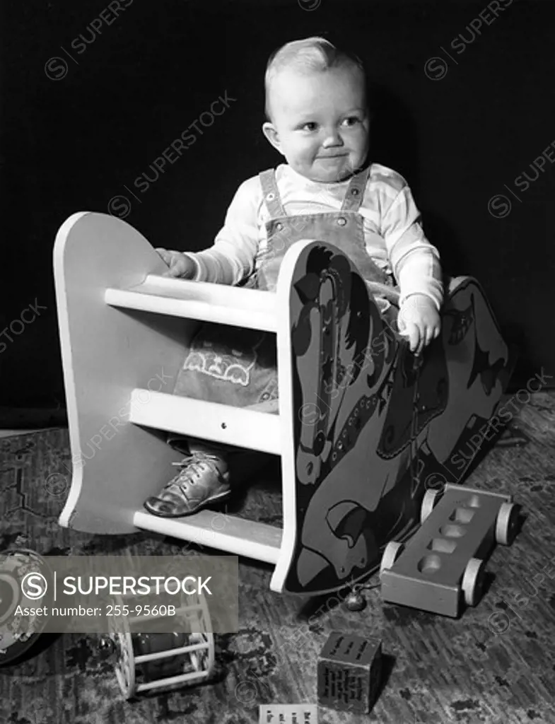 Baby sitting in toy chair