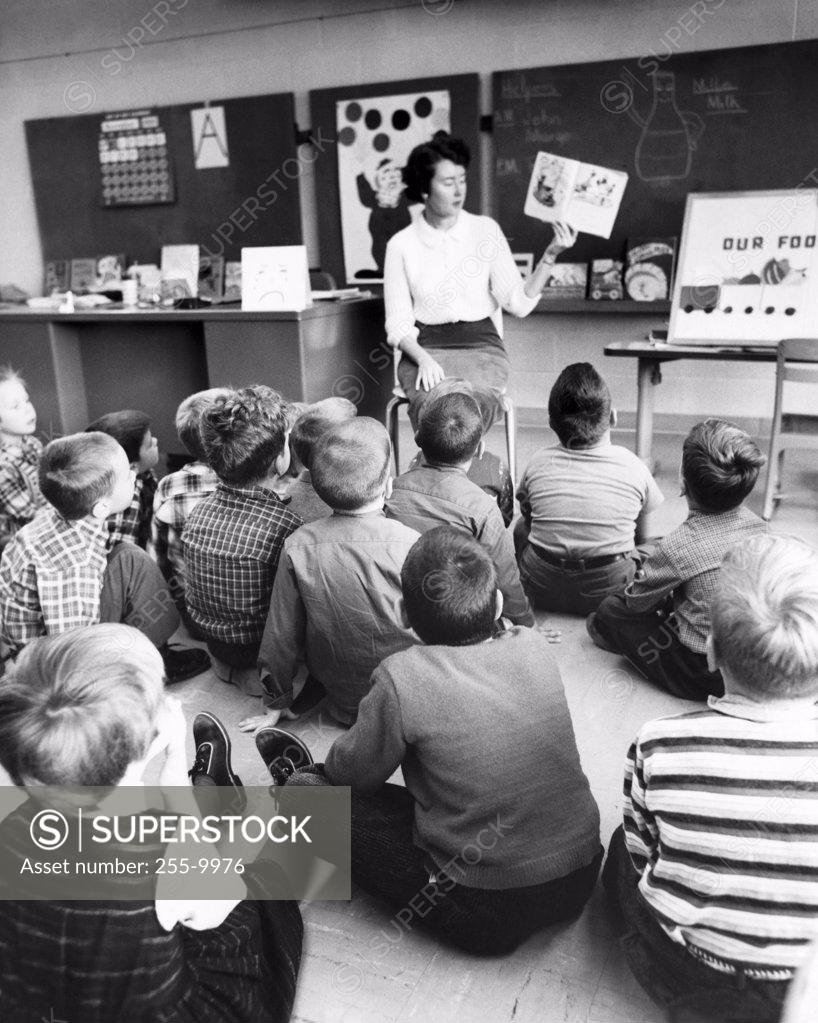 Stock Photo: 255-9976 Teacher teaching students in a classroom