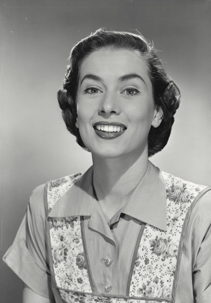 Portrait of smiling brunette woman wearing flowery vest
