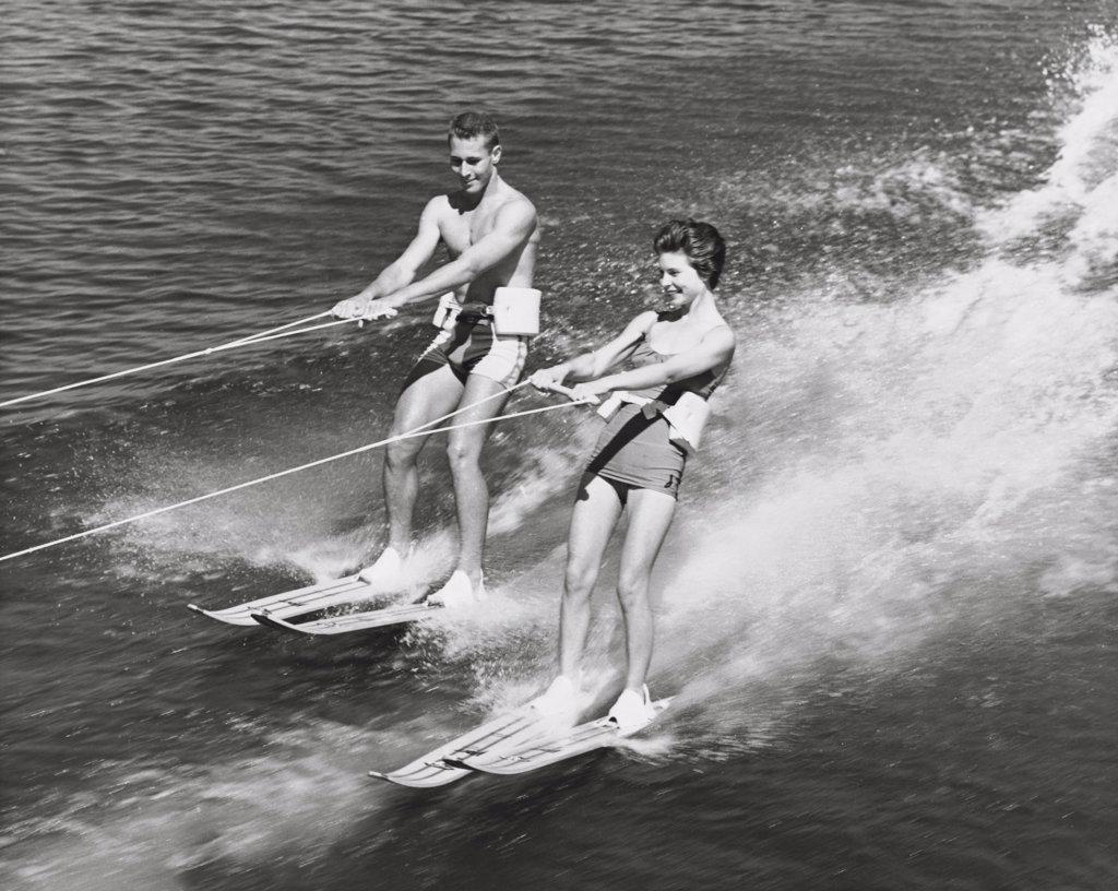 Young couple waterskiing